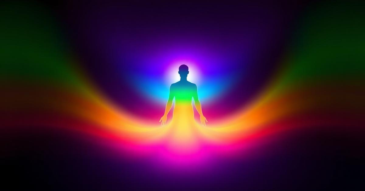 A glowing human silhouette surrounded by layered bands of violet, blue, green, gold and red light